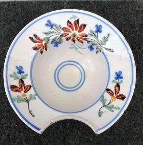 Round shaving dish with floral decoration. France.